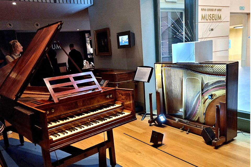 An image of the inside of a piano on display in the RCM Museum